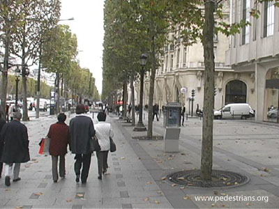 Pedestrians on wide sidewalk in Paris