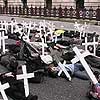 Photo - Protesters in London. Cross mark pedestrian deaths 