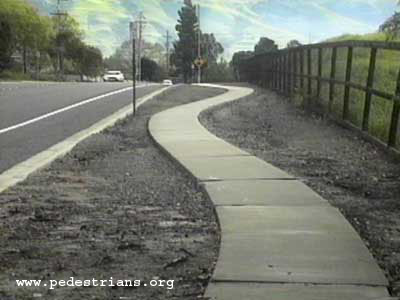 Photo - Absurd curving sidewalk