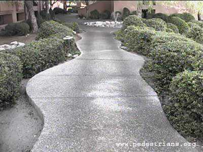 Photo - curved sidewalk design with central straight section.
