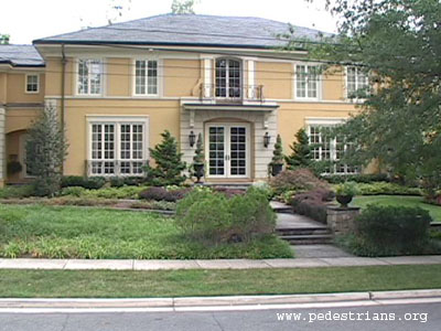 Nice house by sidewalk