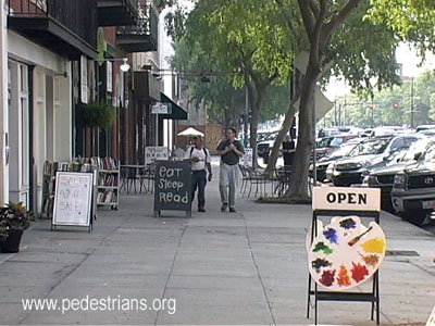 Sandwich boards in sidewalk, Augusta
