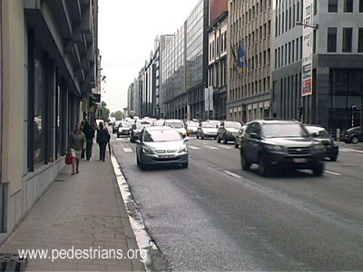 Drab sidewalk on busy street, Brussels