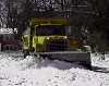 Photo - Snowplow making a pile of snow.